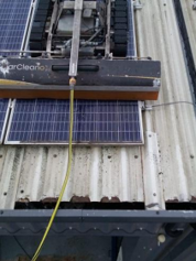 Solar panels being cleaned on the roof of Gandtrack’s manufacturing facility